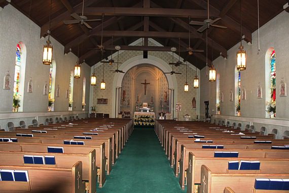 A large church with many pews and chairs