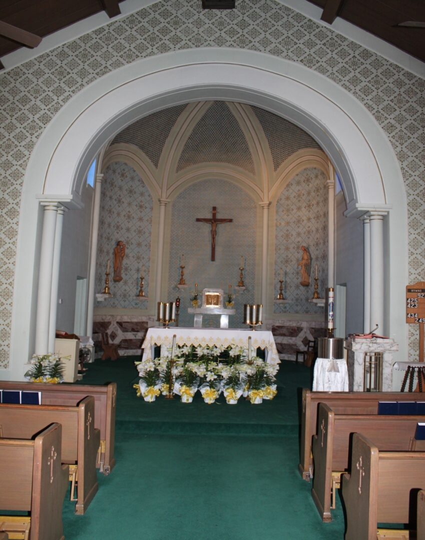 A church with a large altar and pews.