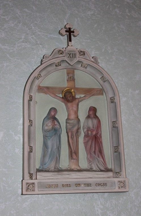 A painting of jesus on the cross with mary and john.