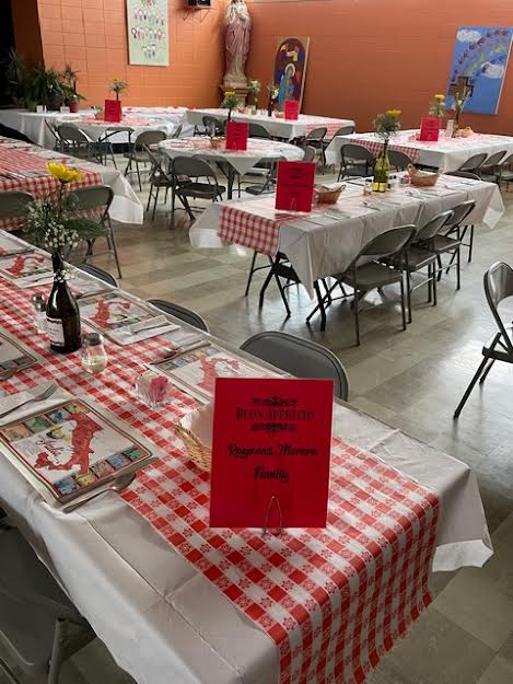 A large table with red and white checkered tablecloth.