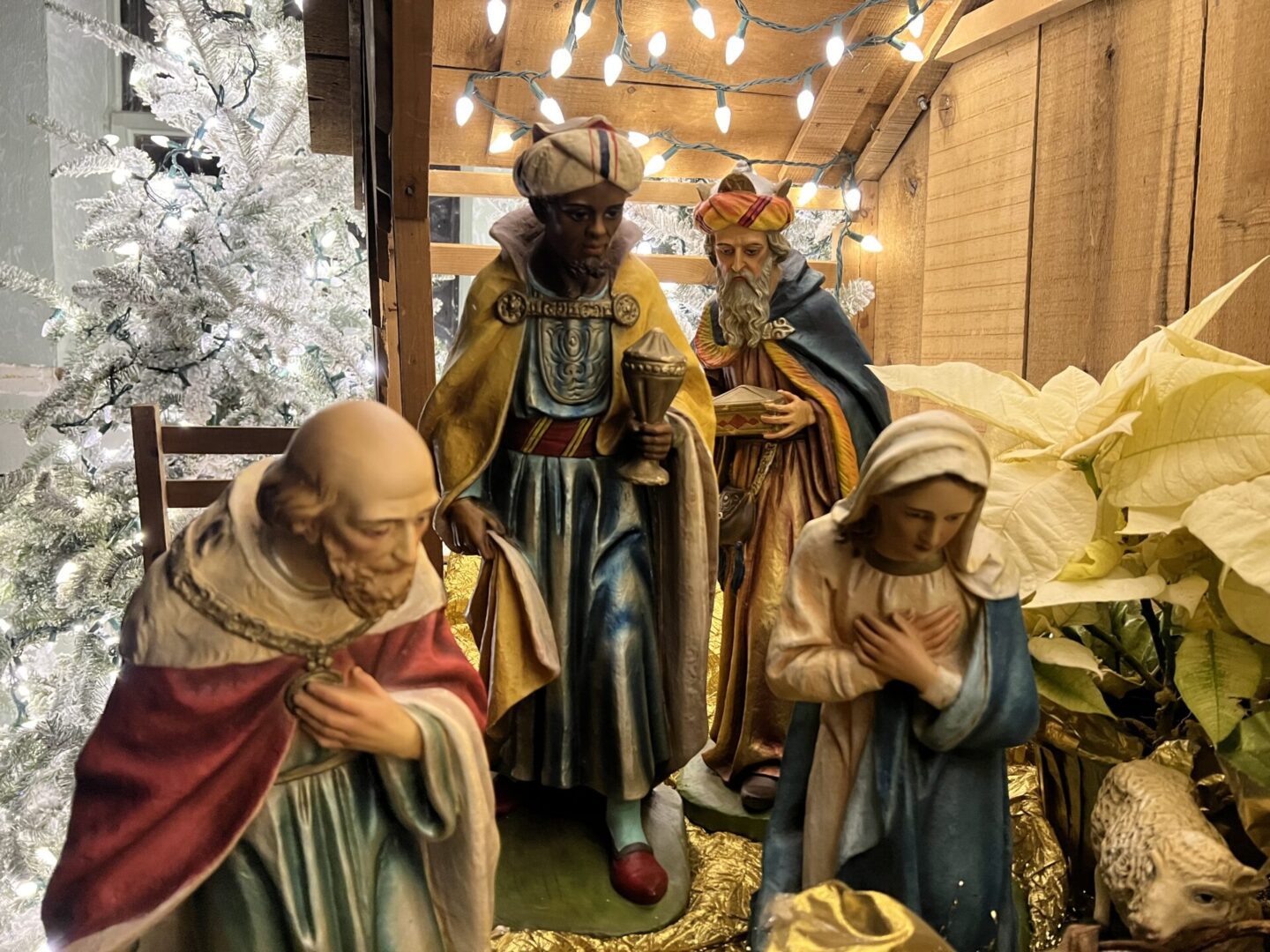 A nativity scene with three kings and one baby jesus.